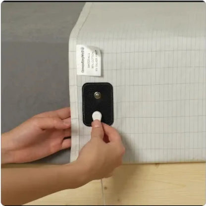 Person using a tool on a grid-patterned surface